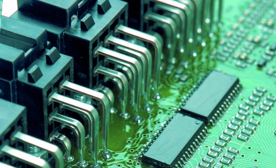Closeup of Printed Circuit Board with Mounted Components. Vertical Shot